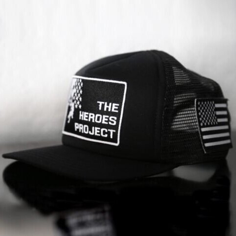 black hat with The Heroes Project embroidered logo