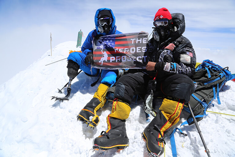 With help from The Heroes Project on May 19th 2016, USMC Veteran Charlie Linville became the first combat wounded Veteran to reach the summit of Mt. Everest, the tallest mountain summit in the world. Pictured here with the Founder of The Heroes Project,Time Medvets.